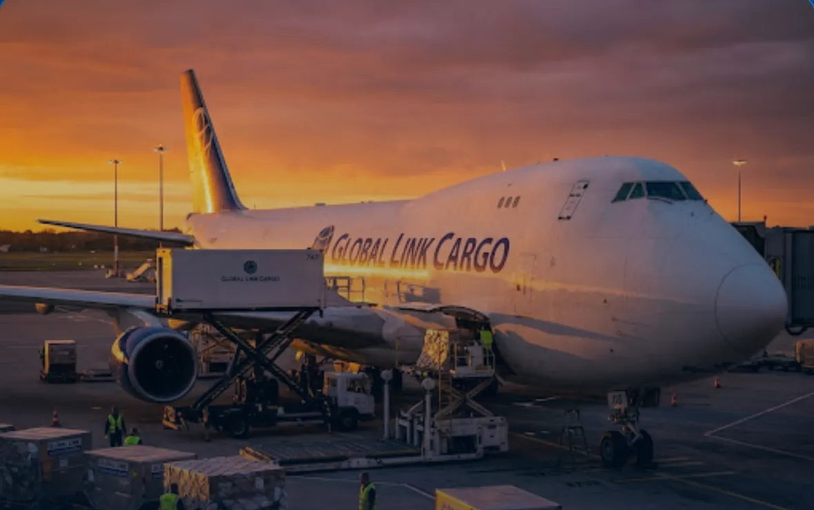 Pesawat kargo (freighter) PT Mega Angkasa Mandiri sedang dimuat dengan kontainer cargo di apron bandara saat senja